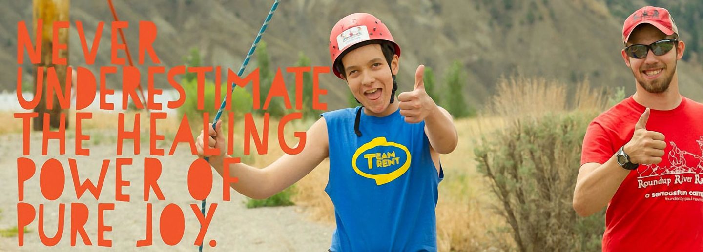 A camper enjoys the high ropes course at Roundup River Ranch free summer camp for kids in Colorado