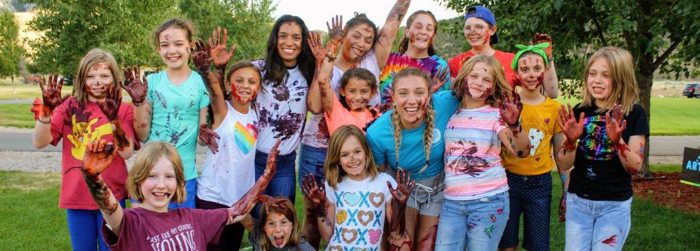 Campers pose for a photo at volunteer summer camp in Colorado