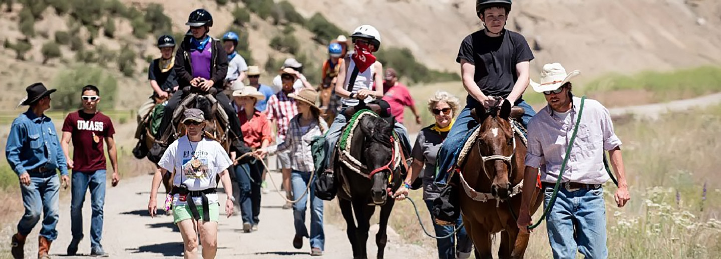 Children on horseback at free summer camp in Colorado