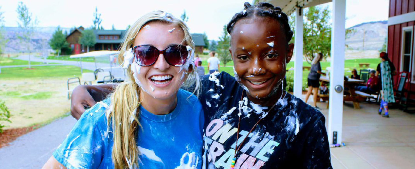 Roundup River Ranch volunteer helps camper enjoy recreational therapeutic activities at nonprofit camp