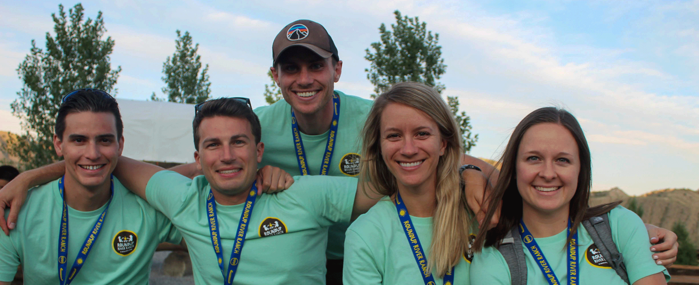 Roundup River Ranch volunteers pose for a photo. Learn more about how to volunteer and additional camp counselor opportunities.