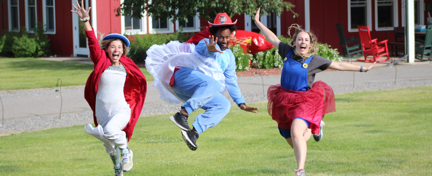 Camp counselors in costume pose for a photo promoting summer camp counselor opportunities at Colorado summer camp