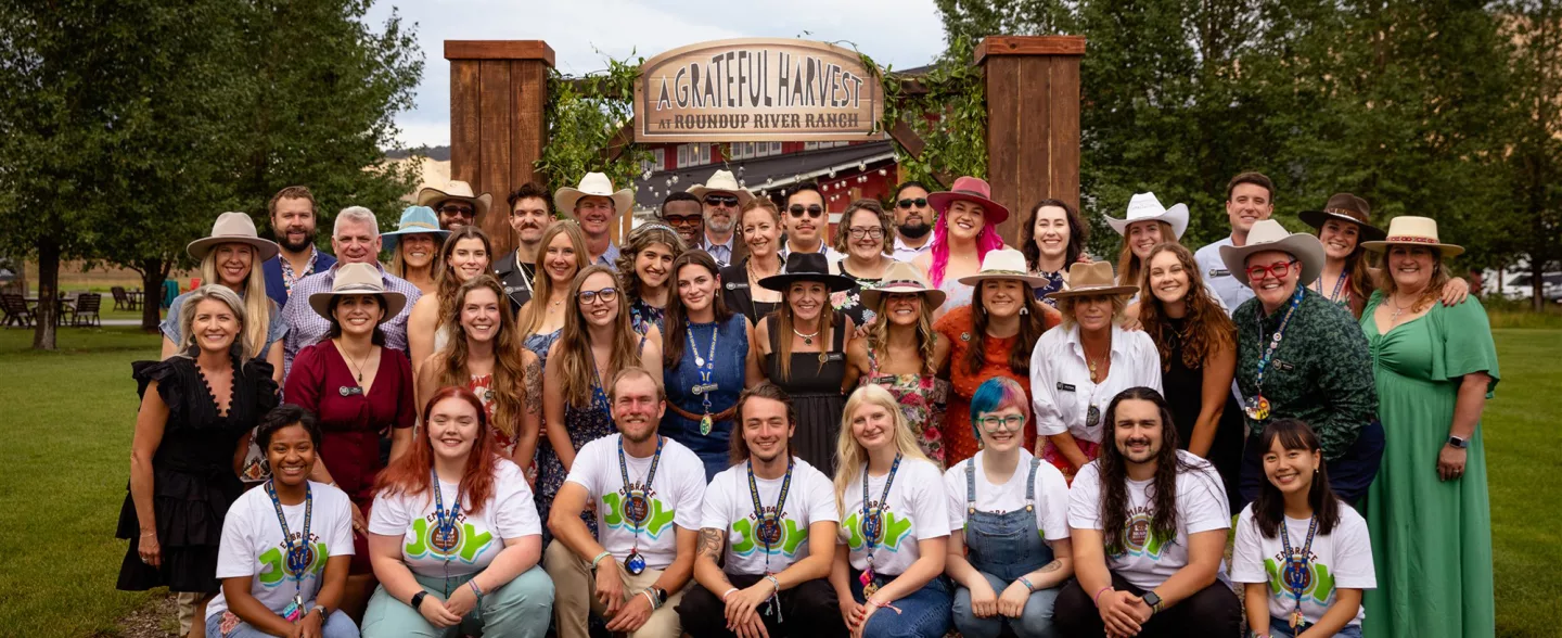 Adult staff pose for a group photo at Colorado nonprofit summer camp