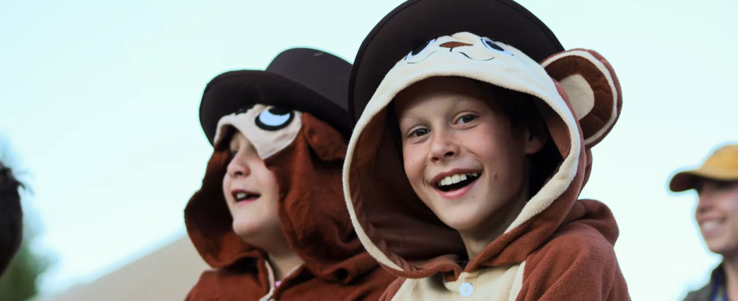 Children in costumes smile for the camera at Roundup River Ranch summer camp in Colorado
